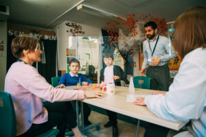 Hearing Unit Children and Teachers Around Table