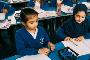 Two Children Working at Desk