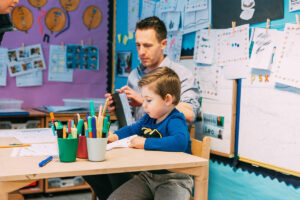 Teacher and Boy at Table